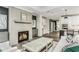 Living room with fireplace flows into an eat-in kitchen and an open layout at 1609 Garden Park Cir, Fuquay Varina, NC 27526