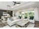 Modern living room and dining room filled with natural light and an open floorplan at 1609 Garden Park Cir, Fuquay Varina, NC 27526