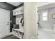 Organized mudroom featuring a built-in bench, storage cubbies, and easy access to the laundry room at 1609 Garden Park Cir, Fuquay Varina, NC 27526