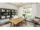 Inviting office space featuring a natural wood desk, modern decor, and lots of natural light at 1609 Garden Park Cir, Fuquay Varina, NC 27526