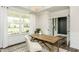 Bright home office featuring a natural wood desk, modern decor, and lots of natural light at 1609 Garden Park Cir, Fuquay Varina, NC 27526