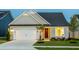 Charming single-Gathering home with a well-manicured lawn and inviting two-car garage at 1610 Garden Park Cir, Fuquay Varina, NC 27526