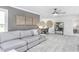 Cozy living room with comfortable sofa, stylish decor, and modern ceiling fan at 1610 Garden Park Cir, Fuquay Varina, NC 27526