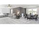 Open-plan living area with a comfortable sectional sofa and dining table at 1610 Garden Park Cir, Fuquay Varina, NC 27526