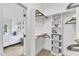 Walk-in closet with shelving, hanging rods, and easy access to the bedroom at 1913 Wild Dunes Dr, Raleigh, NC 27604