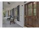 Inviting front porch with seating, decorative pillows, and charming curb appeal at 1913 Wild Dunes Dr, Raleigh, NC 27604