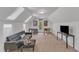 Finished attic game room with skylights, and features a sofa, TV and foosball table at 1913 Wild Dunes Dr, Raleigh, NC 27604