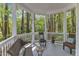 Cozy outdoor seating area with scenic views of the surrounding lush trees at 1913 Wild Dunes Dr, Raleigh, NC 27604