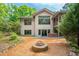 The backyard features a stone fire pit and has direct access to a screened porch and a hot tub at 201 Summergate Cir, Chapel Hill, NC 27516