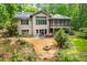 Stunning backyard featuring a fire pit, hot tub, and a screened-in porch perfect for entertaining at 201 Summergate Cir, Chapel Hill, NC 27516