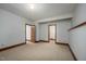 Spacious carpeted bedroom with wood trim, offering plenty of room for relaxation and personalization at 201 Summergate Cir, Chapel Hill, NC 27516