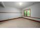 Cozy carpeted bedroom featuring wood trim around window and baseboards with great natural light at 201 Summergate Cir, Chapel Hill, NC 27516