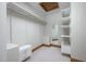 Walk-in closet with custom shelving, drawers, and a full-length mirror, maximizing organization at 201 Summergate Cir, Chapel Hill, NC 27516