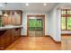 Dining area offering wooden cabinets and bar top with access to a screened-in patio at 201 Summergate Cir, Chapel Hill, NC 27516