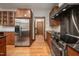 Kitchen with stainless steel refrigerator, wooden cabinets, and granite countertops at 201 Summergate Cir, Chapel Hill, NC 27516