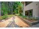Stone walkway and retaining wall highlight the natural landscaping around this beautiful home at 201 Summergate Cir, Chapel Hill, NC 27516