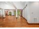 Spacious living room featuring hardwood floors, an open layout, and large windows at 201 Summergate Cir, Chapel Hill, NC 27516
