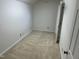 A bedroom with neutral carpeting, off-white walls, and two doors at 202 Selkirk Pl, Durham, NC 27707