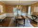 Bright dining room with floral wallpaper, large table, and chandelier lighting at 202 Selkirk Pl, Durham, NC 27707