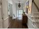 Inviting foyer with hardwood floors, decorative chandelier, and staircase at 202 Selkirk Pl, Durham, NC 27707