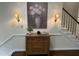 Entryway featuring hardwood floors, decorative chest, and stairway at 202 Selkirk Pl, Durham, NC 27707