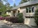 Beautiful one-story brick home featuring an attached garage and landscaped front yard at 202 Selkirk Pl, Durham, NC 27707