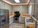 Functional kitchen featuring stainless steel appliances, and granite countertops at 202 Selkirk Pl, Durham, NC 27707
