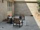 This patio features brick walls, gray tile, and outdoor seating, providing a cozy outdoor space at 202 Selkirk Pl, Durham, NC 27707