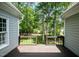 A home's back deck offers a relaxing view of the lush, green backyard, perfect for outdoor enjoyment at 216 Billingrath Turn Ln, Cary, NC 27519