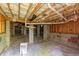 Spacious basement area featuring concrete block foundation, vapor barrier, and exposed ceiling insulation at 216 Billingrath Turn Ln, Cary, NC 27519