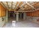 Finished basement area featuring concrete block foundation, vapor barrier, and exposed ceiling insulation at 216 Billingrath Turn Ln, Cary, NC 27519