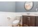 Well-lit bathroom features white walls and a dark vanity at 216 Billingrath Turn Ln, Cary, NC 27519