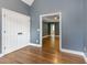 Hardwood floors and neutral paint create a serene bedroom atmosphere at 216 Billingrath Turn Ln, Cary, NC 27519