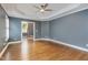 Hardwood floors and a ceiling fan highlight this cozy bedroom at 216 Billingrath Turn Ln, Cary, NC 27519