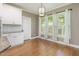 Dining area boasts natural light, white cabinets, and granite countertops at 216 Billingrath Turn Ln, Cary, NC 27519