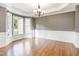 Bright dining room features a bay window and elegant chandelier at 216 Billingrath Turn Ln, Cary, NC 27519