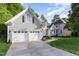 Beautiful home featuring a 2-car garage, sidewalk, and manicured lawn at 216 Billingrath Turn Ln, Cary, NC 27519