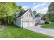 Charming home with a two-car garage, a well-kept lawn and beautiful landscaping at 216 Billingrath Turn Ln, Cary, NC 27519