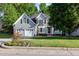 Charming two-story home with well-manicured lawn and mature trees at 216 Billingrath Turn Ln, Cary, NC 27519