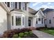 Charming home exterior featuring a manicured lawn, detailed entrance, and beautiful curb appeal at 216 Billingrath Turn Ln, Cary, NC 27519
