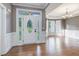 Inviting front foyer with decorative glass front door and hardwood floors at 216 Billingrath Turn Ln, Cary, NC 27519