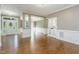 Spacious living room featuring hardwood floors, white trim, and neutral wall paint at 216 Billingrath Turn Ln, Cary, NC 27519