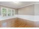 Hardwood floors and large windows brighten the living room at 216 Billingrath Turn Ln, Cary, NC 27519