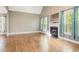 Cozy living room with vaulted ceilings, fireplace, and large windows at 216 Billingrath Turn Ln, Cary, NC 27519