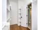 Walk-in closet with custom shelving and hanging racks at 216 Billingrath Turn Ln, Cary, NC 27519