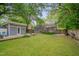 This property has a deck, patio, green grass, mature trees and a shed for outdoor entertaining at 2442 Stevens Rd, Raleigh, NC 27610
