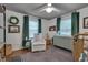 Cozy bedroom boasts a neutral color palette and lots of light from the large windows at 2442 Stevens Rd, Raleigh, NC 27610