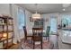 Bright dining room with hardwood floors and modern lighting fixtures at 2442 Stevens Rd, Raleigh, NC 27610