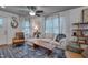 Cozy living space featuring modern furniture, and bright natural light from the windows at 2442 Stevens Rd, Raleigh, NC 27610