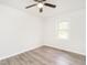 An unfurnished room featuring updated flooring and a geometrically designed window allowing in natural light at 2581 Green Valley Blvd, Burlington, NC 27217